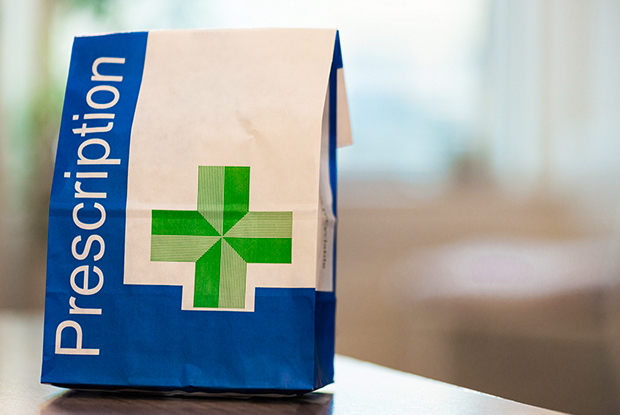 image shows a prescription bag from a pharmacy 